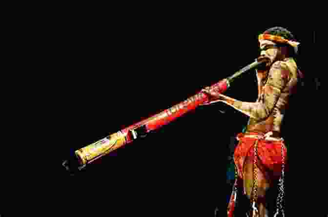 A Didgeridoo Player Performing In The Australian Outback The Soundscapes Of Australia: Music Place And Spirituality