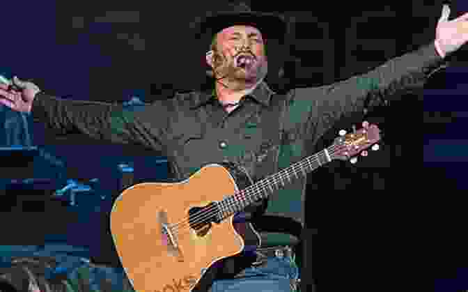 Garth Brooks Performing Live On Stage With A Guitar The Music Of Garth Brooks